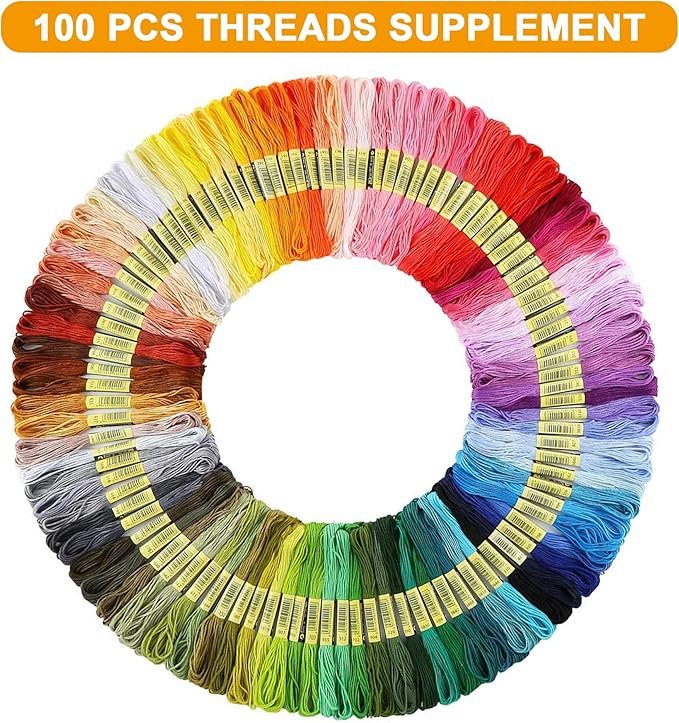 A circular display features 100 colourful threads from the Hand Embroidery Starter Kit (364 pieces), neatly arranged by shade. An orange banner at the top reads "100 PCS THREADS SUPPLEMENT" in white text.