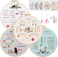 The Embroidery Stitch Practice Kit 6 features four hoops showcasing colourful floral and animal designs with stitch techniques like French knots and lazy daisy, plus embroidery tools, thread, and instruction sheets arranged above.
