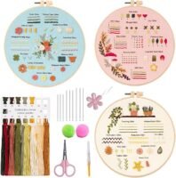 The Embroidery Stitch Practice Kit 8 includes three hoops with stitch samples and floral designs, colourful thread skeins, embroidery needles, scissors, felt circles, a flower-shaped needle threader, and an instruction card.