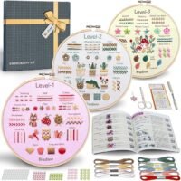 Embroidery Stitch Practice Kit 12 includes a gift box, three labelled embroidery hoops (Levels 1–3) with diverse stitches, thread, scissors, needles, instruction booklet, and colourful beads—all neatly arranged.