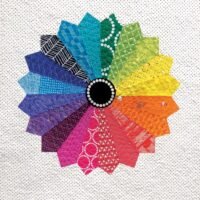 The cover of "Colour Basics for Makers: Understanding the Rainbow" by Lee Monroe features a vibrant quilt block with 16 rainbow-coloured petals and patterns, set on a white dotted background with a black centre.