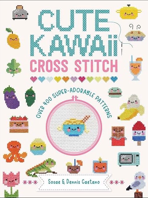 Book cover titled Cute Kawaii Cross Stitch featuring colourful cross-stitched designs of smiling foods, objects, and animals on a white background. Text highlights Over 400 super-adorable patterns.