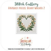 Yellow flowers and green leaves form a heart design on white fabric in Heart Wreath 2: Hand embroidery pattern, featured in Daydream Stitchery’s Stitch Gallery—a beautiful love-inspired embroidery piece.