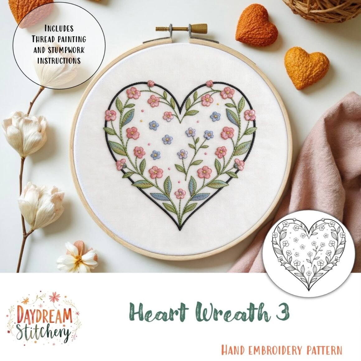 An embroidery hoop shows a heart-shaped floral wreath with pink flowers and green leaves. Around it are flowers, heart-shaped yarn, and fabric. Text reads: Heart Wreath 2: Hand embroidery pattern by Daydream Stitchery.
