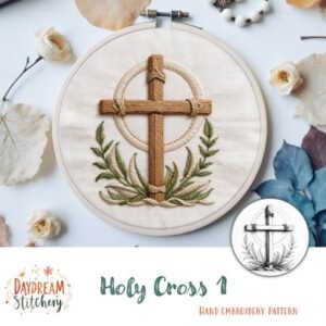 A wooden embroidery hoop displays a cross with green leaves stitched below, surrounded by dried flowers. Text reads "Holy Cross: Hand embroidery pattern" and Daydream Stitchery.