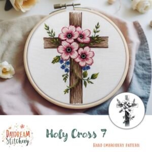 The Holy Cross 7: Hand embroidery pattern by Daydream Stitchery features a wooden cross framed in an embroidery hoop, adorned with pink and red flowers and green leaves for a beautiful, faith-inspired design.
