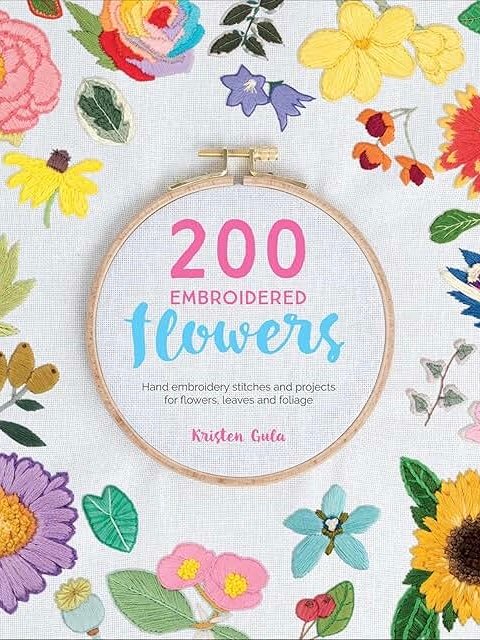 A book cover with vibrant embroidered flowers encircling a hoop. Inside, the text reads: 200 Embroidered Flowers, by Kristen Gula—featuring hand embroidery stitches and projects for flowers, leaves, and foliage.