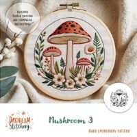 The Mushroom 3a: Hand embroidery pattern features three red-capped mushrooms, green leaves, and flowers in an embroidery hoop. Text includes “Mushroom 3” and “Hand Embroidery Pattern.” Instructions are included.