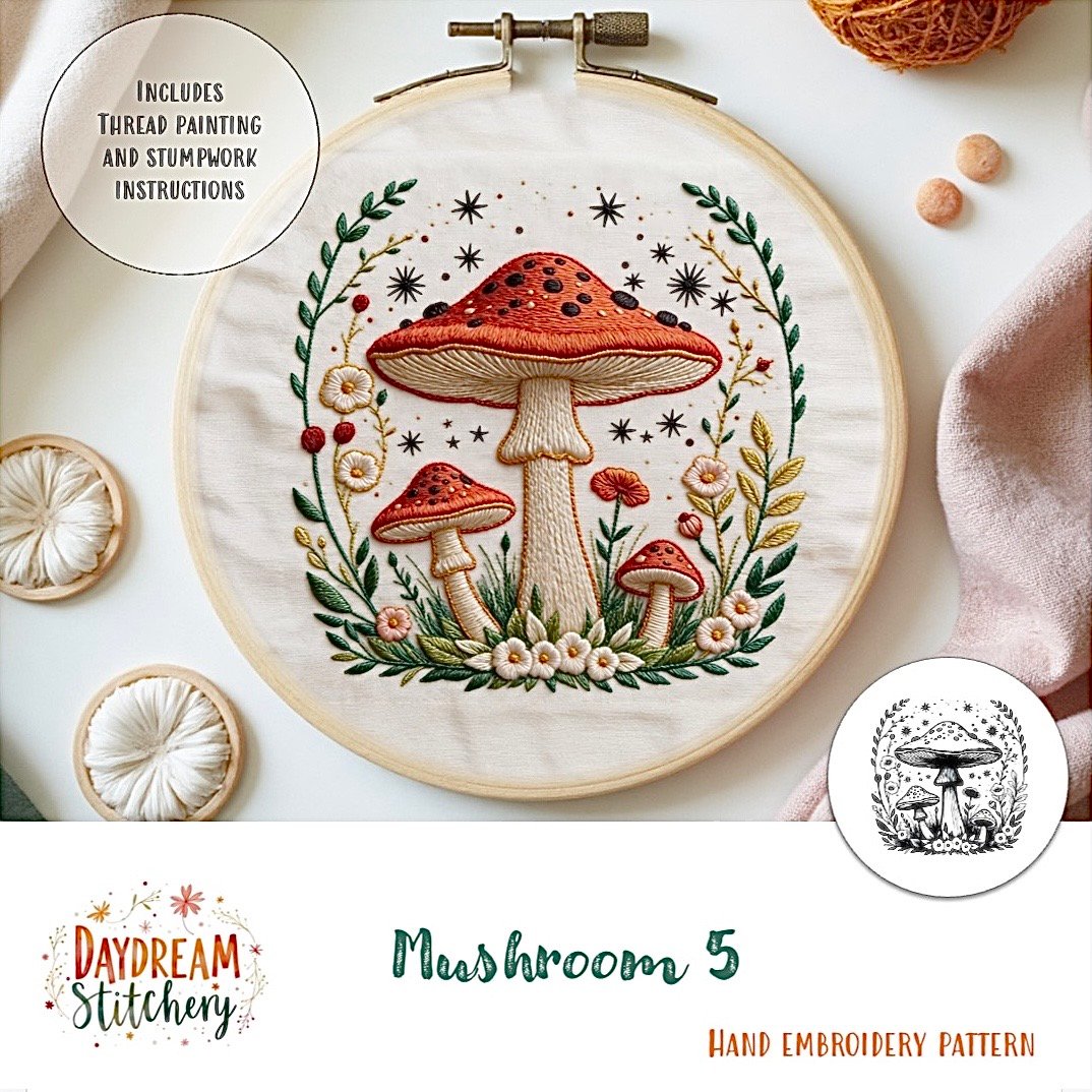 Mushroom 5: Hand embroidery pattern features three red mushrooms with white spots, surrounded by green leaves, flowers, and decorative accents. This charming design is from Daydream Stitchery.