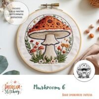 A hand embroidery hoop features a vibrant mushroom scene with flowers and leaves. The text "Mushroom 6: Hand embroidery pattern" appears, along with an inset displaying the black-and-white design.