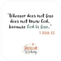 Text reads: Whoever does not love does not know God, because God is love. 1 John 4:8. Below is a floral design with “Daydream Stitchery,” inspired by our ‘God is Love’ hand embroidery pattern.