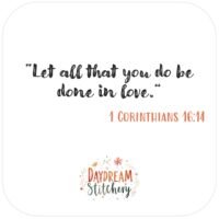 White square image with "Let all that you do be done in love. 1 Corinthians 16:14" and a floral design reading Daydream Stitchery—perfect for the ‘Let all that you do’: Hand embroidery patterns, ideal for ‘Love like Jesus’ stitching projects.